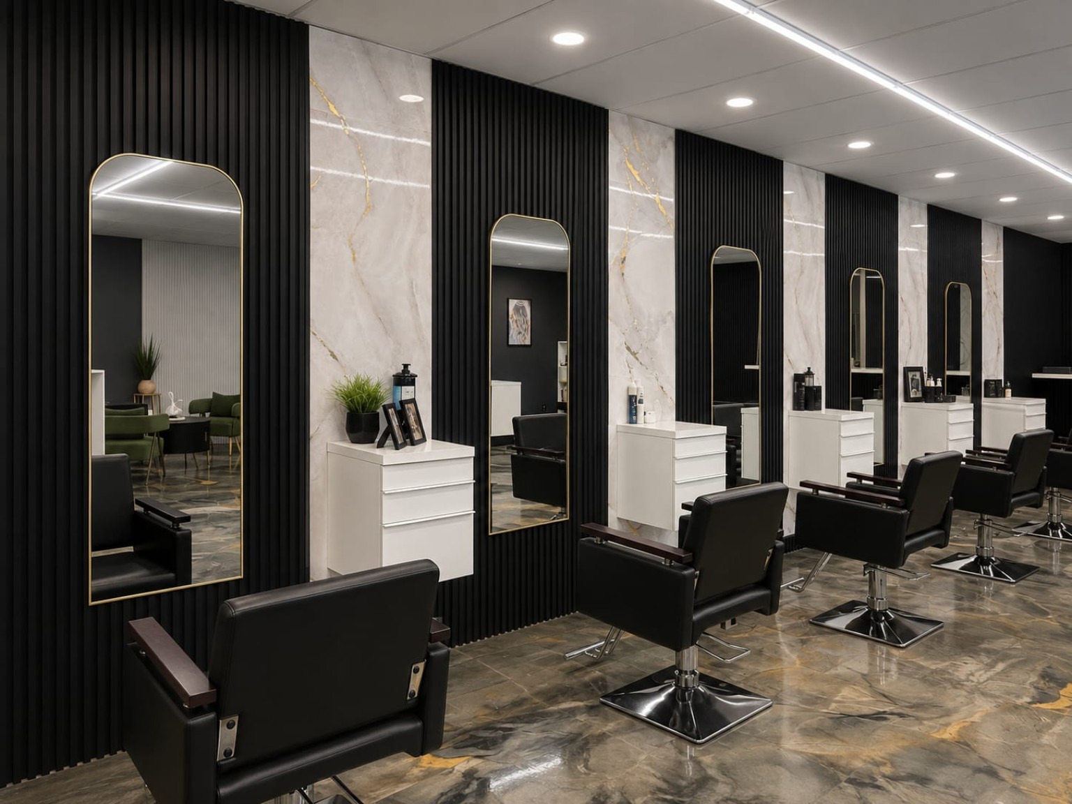 Gold-framed mirrors and black styling chairs in the salon
